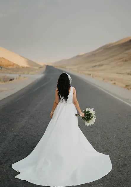 Beautiful lace wedding gown with a long train