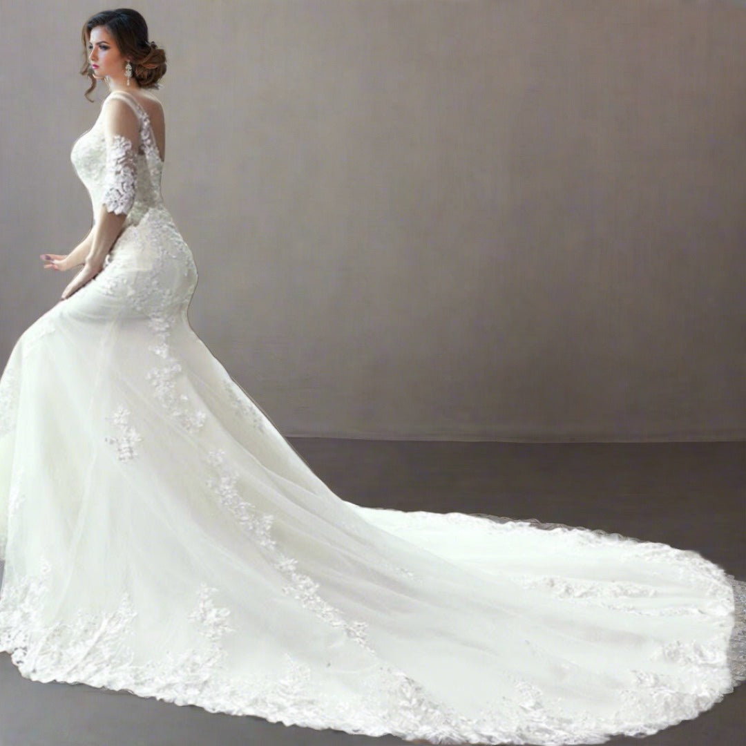 mermaid style A-line gown with delicate lace patterns.