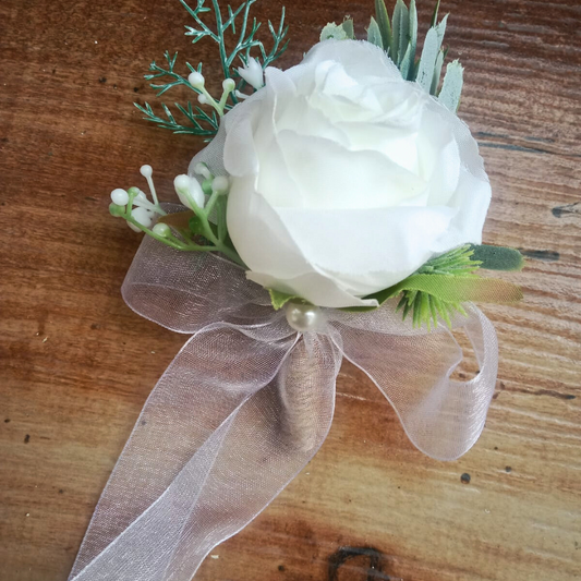 White Christian groom coat flower Dungarpur India