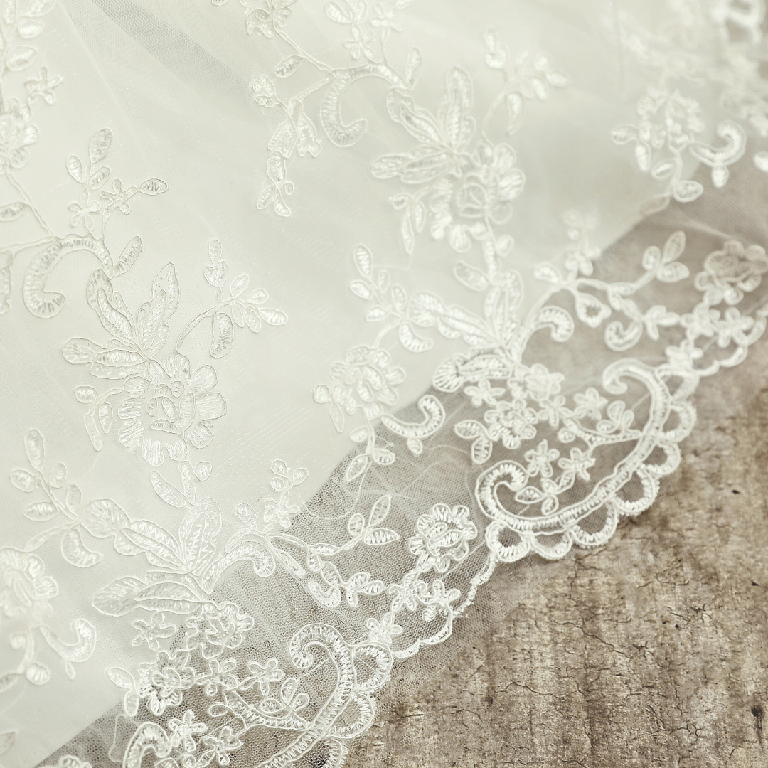 Classic white Christian bridal gown with lace detailing." Kottayam India