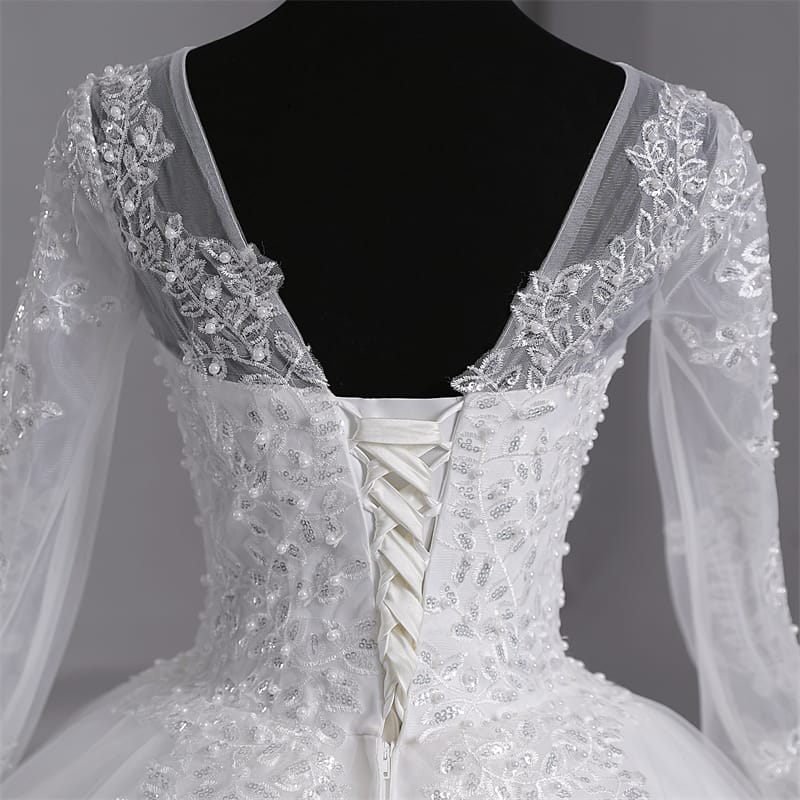 Timeless Catholic bridal gown featuring a lovely back part of train.