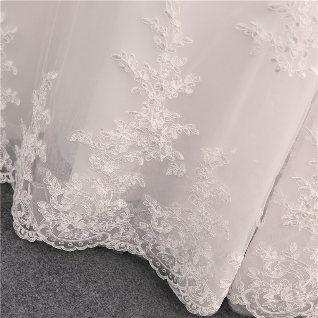 Boho-chic off-the-shoulder lace wedding gown