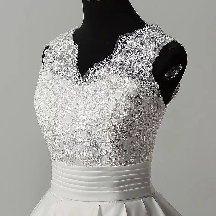 Sleeveless Catholic white wedding train gown with an ethereal train.