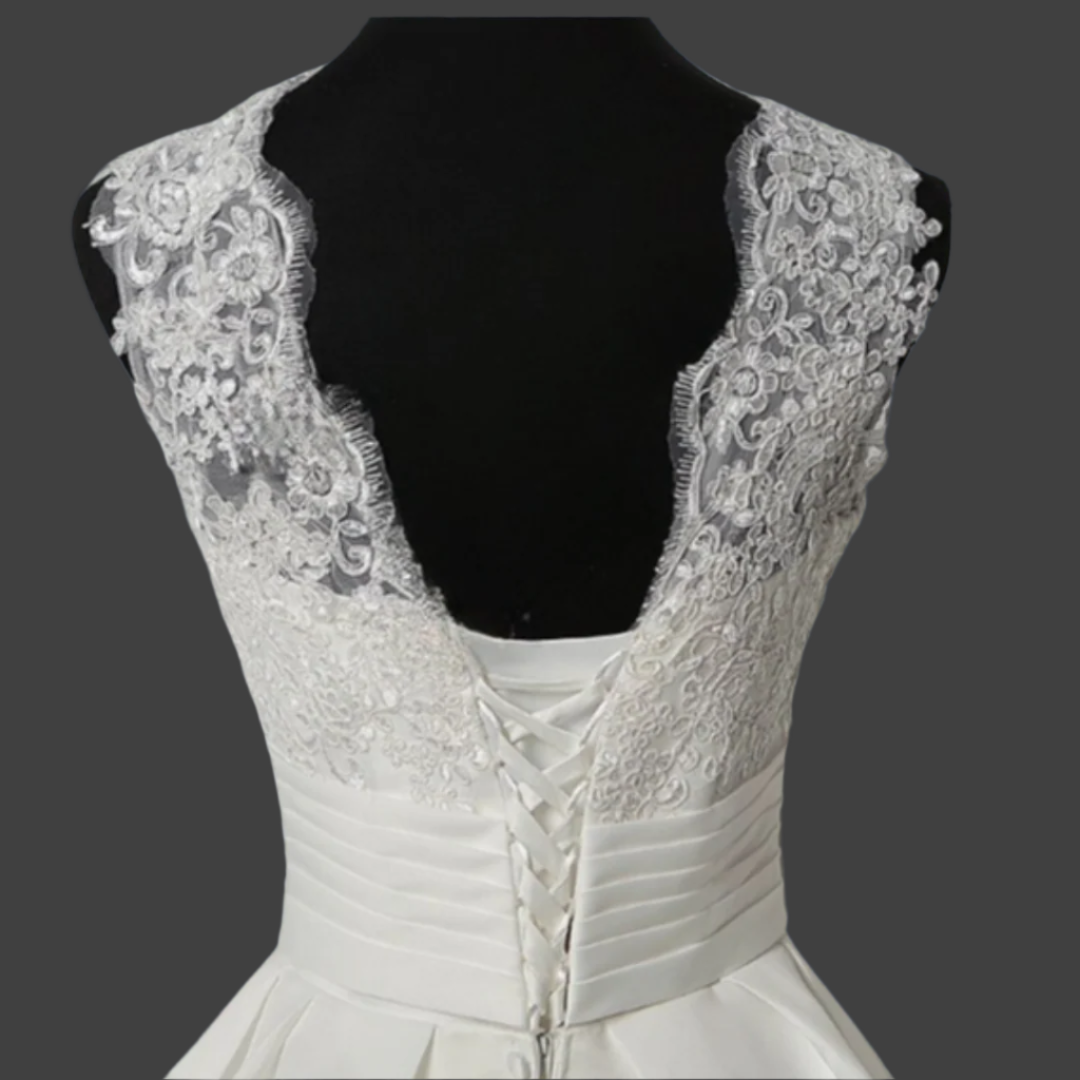 Vintage-inspired white Catholic wedding dress with a patches train.