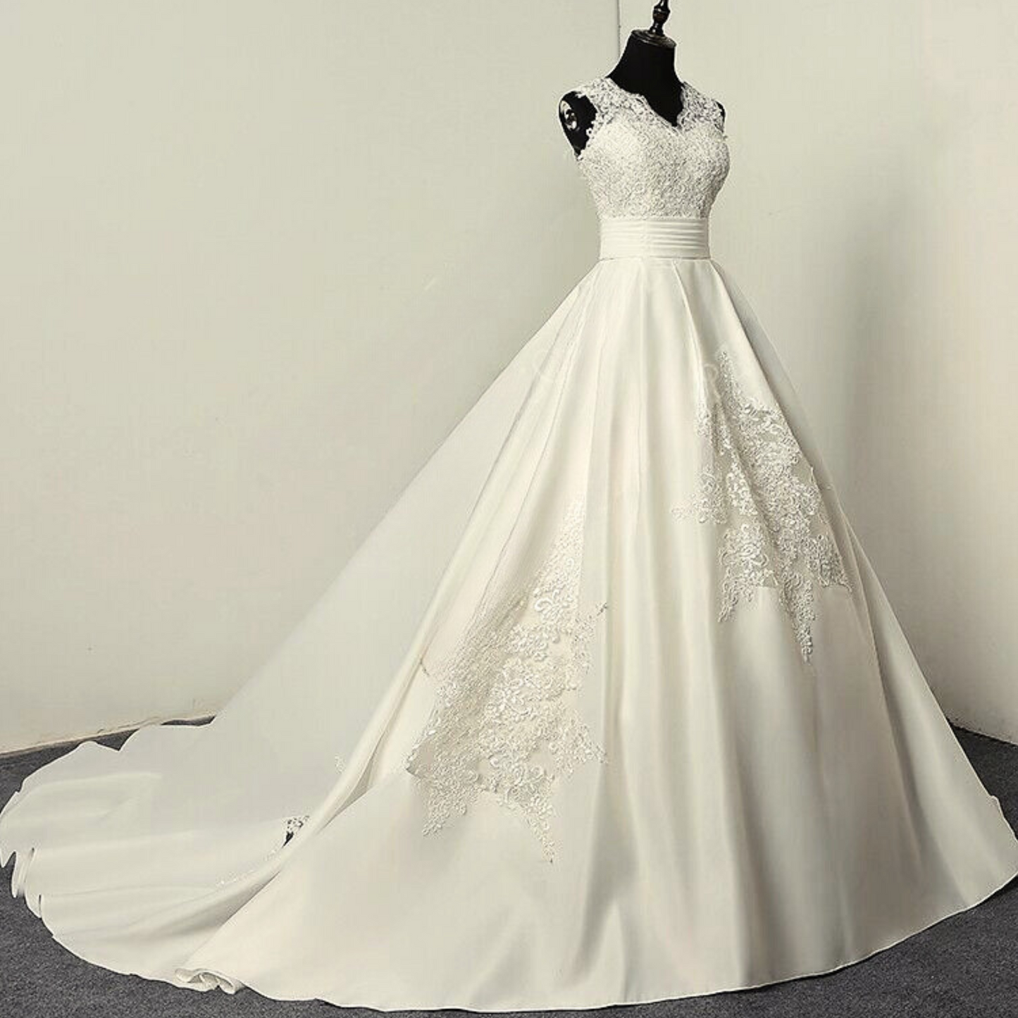 Flowy Christian white wedding gown with a satin train.