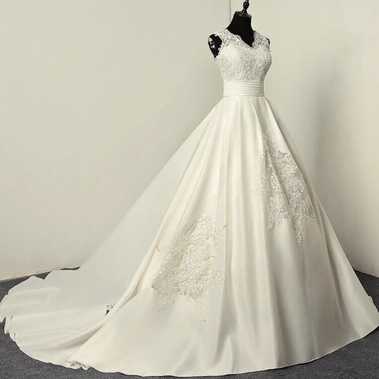 Flowy Christian white wedding gown with a satin train.