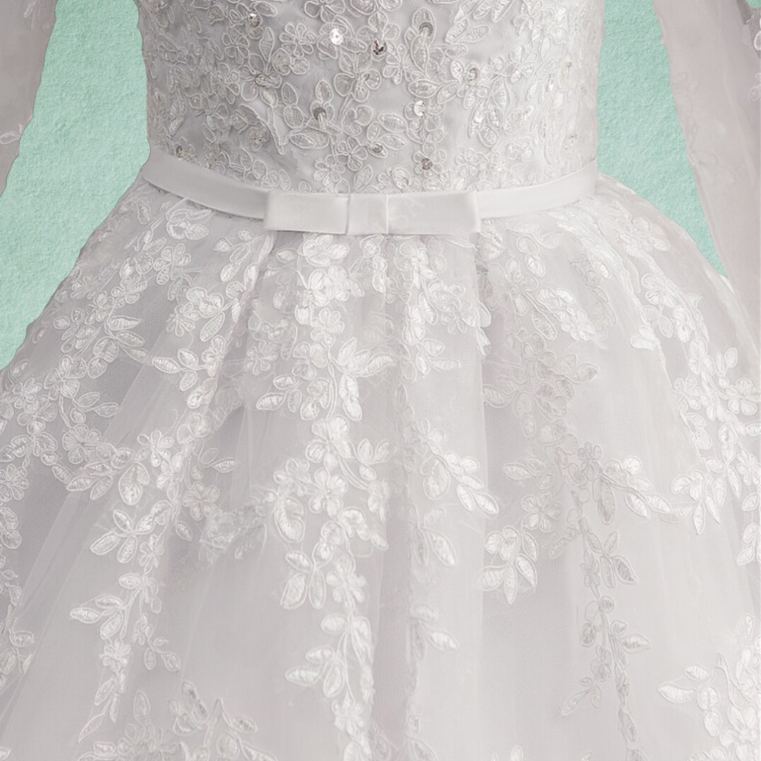 Romantic blush pink wedding dress with floral appliques
