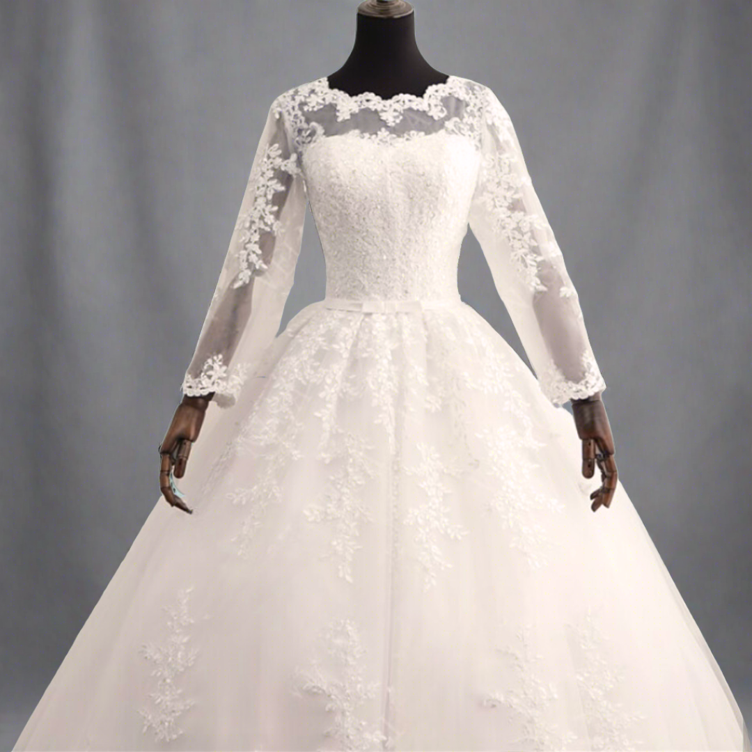 Grecian-inspired white draped wedding gown with a flowing train
