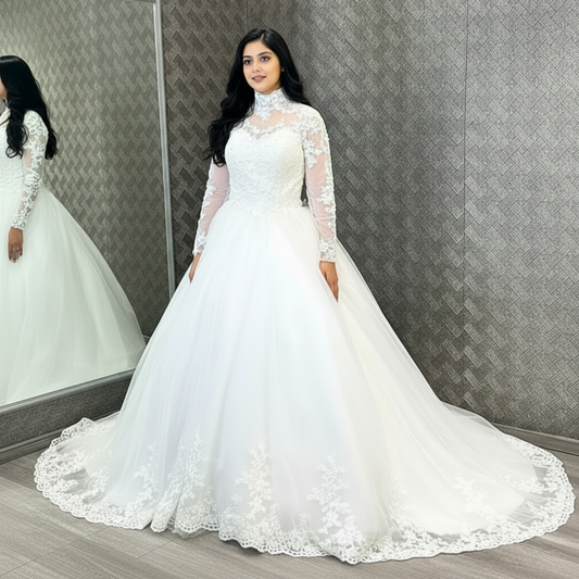 White Christian bridal ball gown featuring sheer lace sleeves, embroidered bodice, and a full tulle skirt
