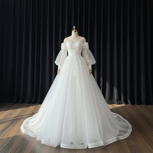 Front view of White Bridal Gown with Long Train on model against studio backdrop — GownLink GLHS14T