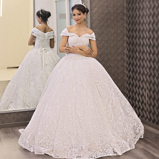 White princess bridal gown featuring floral lace embroidery and a timeless Christian wedding design