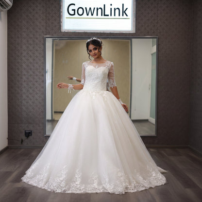 GownLink’s Luxury Bridal Ball Gown for Christian & Catholic Weddings Designer White Princess Wedding Dress with Transparent Full Lace Sleeves & Elegant Royal Flare-GLGF074