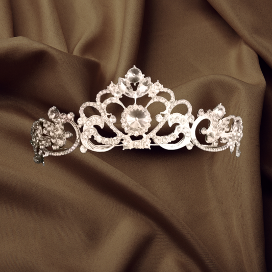 "Regal Sapphire White Crown with Royal Allure – Command attention with this majestic piece."