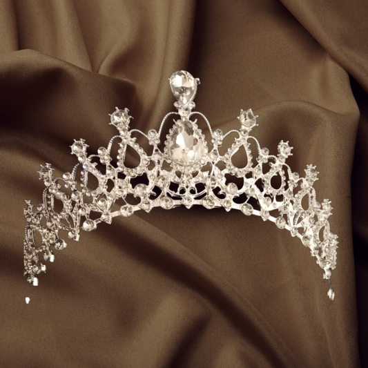 "Handcrafted Silver Tiara with Delicate Floral Motifs – Add a touch of romance to your look."