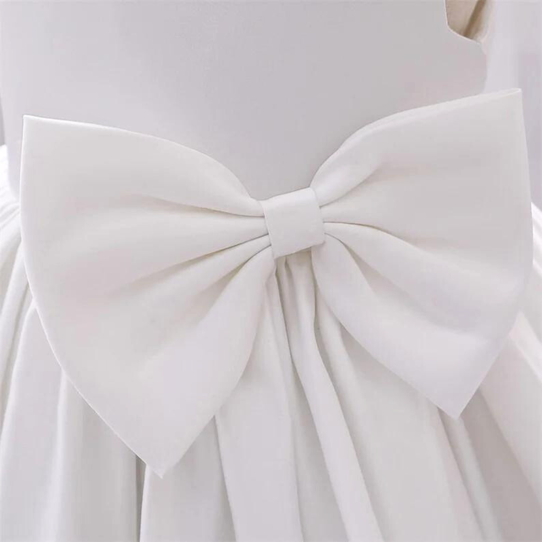 "Graceful Simplicity: White Holy Communion Gown for a Sacred Celebration"