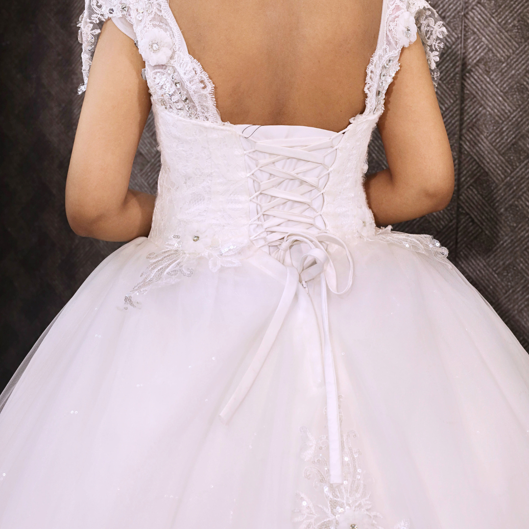 Detail of neckline and bodice on White Bridal Gown with Train — GownLink GLQTH343