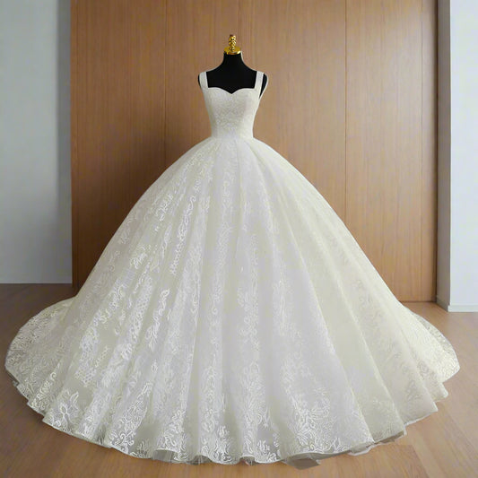 Elegant white ball gown wedding dress with floral lace fabric and sweetheart neckline