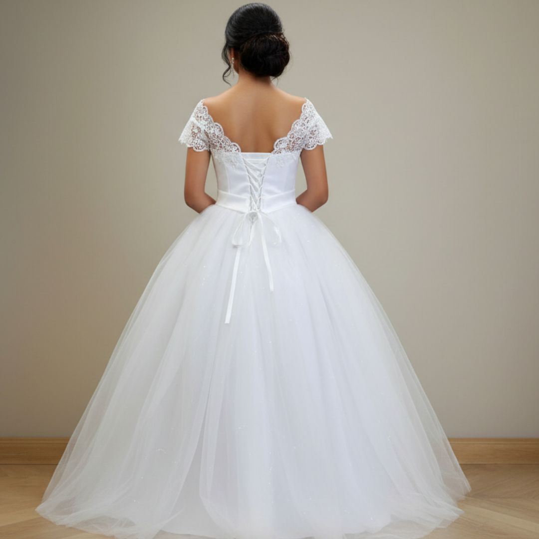 Luxe white bridal ball gown with delicate lace detailing and voluminous tulle skirt
