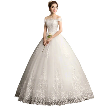 Front view of White Bridal Gown with Off Shoulder on model against studio backdrop — GownLink GLQD09