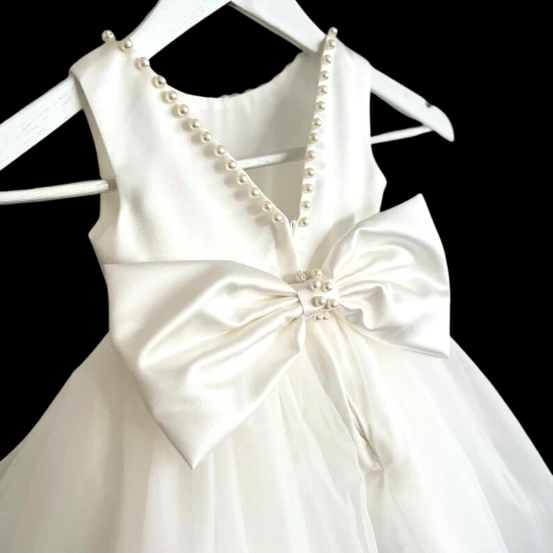 "Celebrate Spiritual pearl Bow with our White Holy Communion Dress."