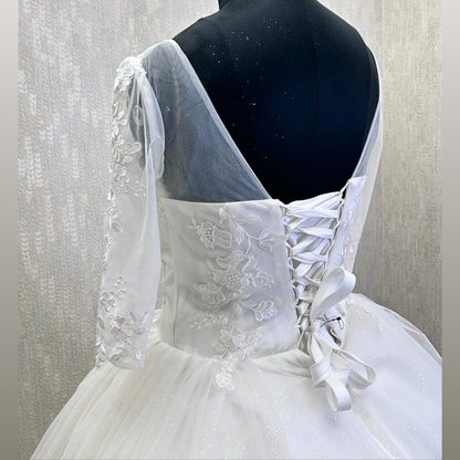 GownLink’s Luxury Bridal Ball Gown for Christian & Catholic Weddings Designer White Princess Wedding Dress with Transparent Full Lace Sleeves & Elegant Royal Flare-GLGF074