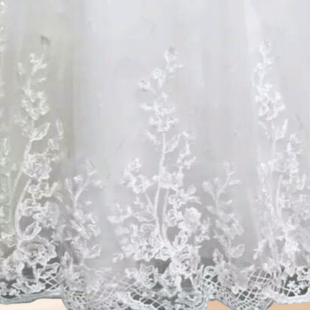 White bridal gown for church weddings featuring a modest neckline, lace sleeves, and elegant embroidery