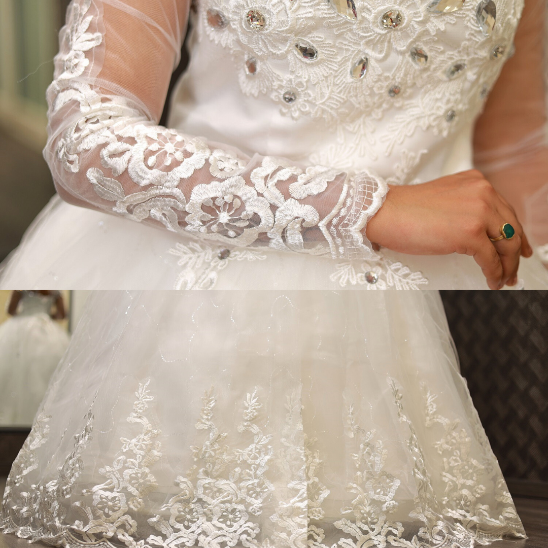 Bridal gown with sheer lace sleeves and embroidered floral details by GownLink