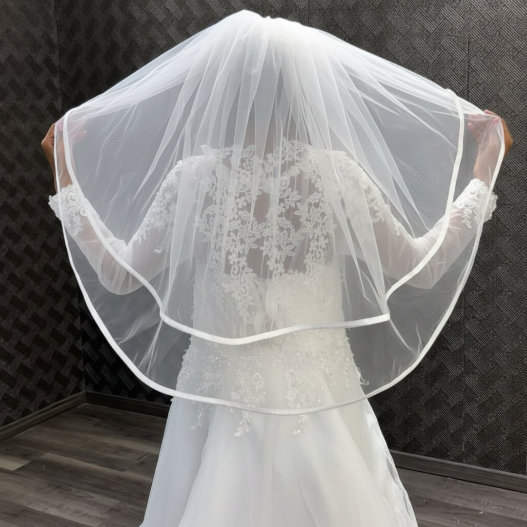 White church wedding veil with elegant satin ribbon border and comb