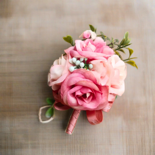 Dapper Black Tuxedo Jacket Adorned with a bunch peach pink Rose Corsage