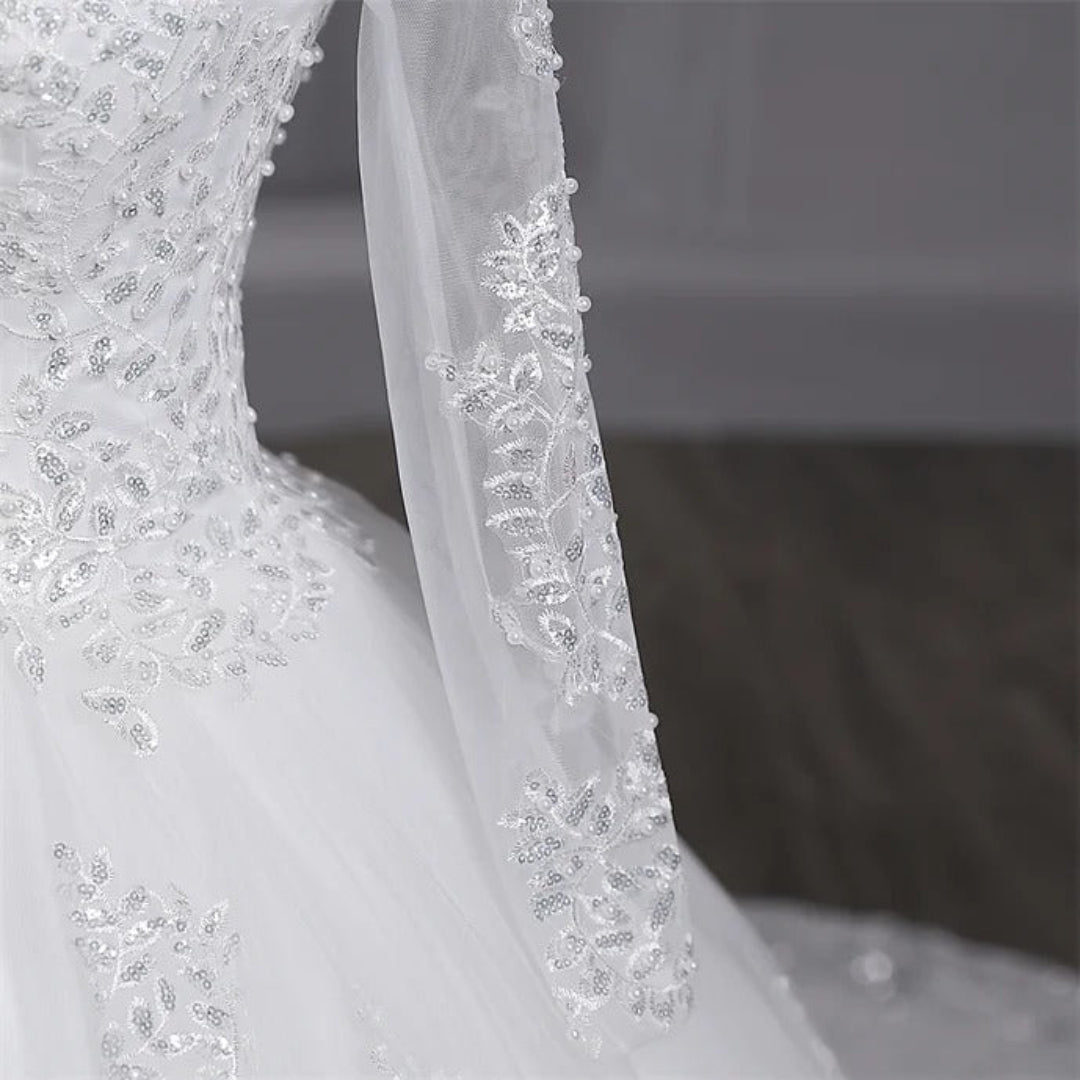 Christian cathedral bridal gown featuring delicate lace embroidery and elegant layered tulle