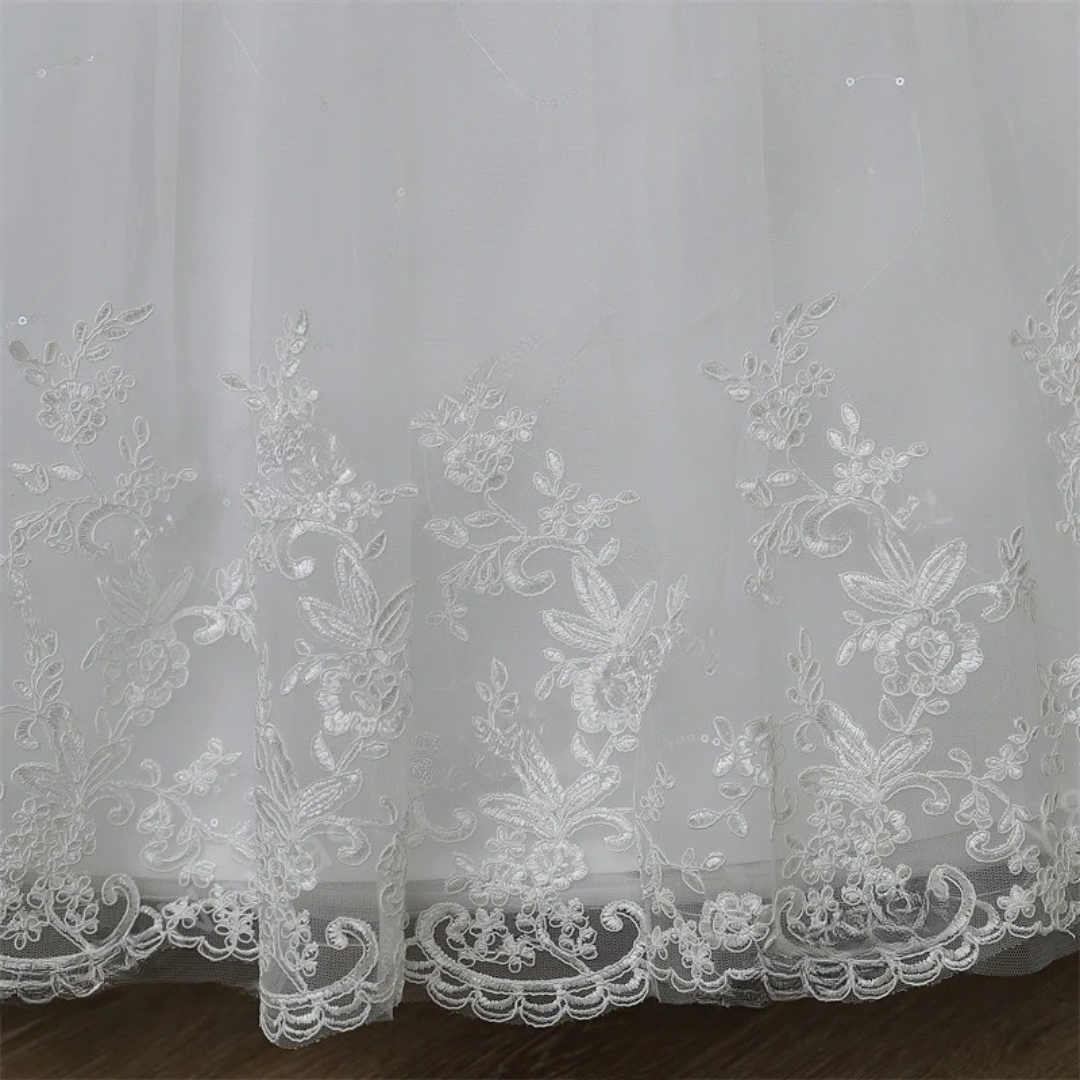 Detail of neckline and bodice on White Ball Gown — GownLink GLHSD189CB