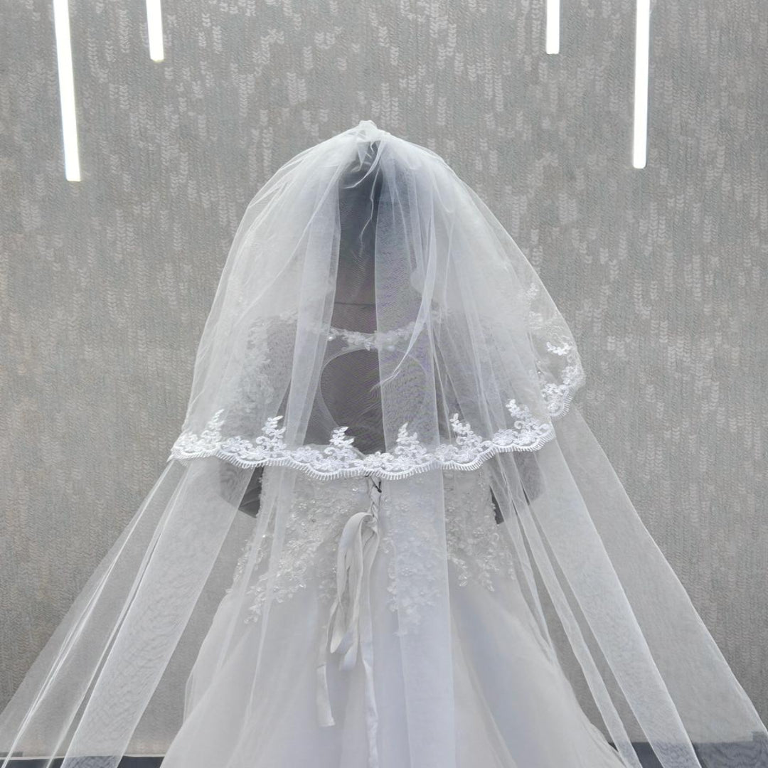 Elegant white church wedding veil with soft tulle, lace border, and face covering blusher