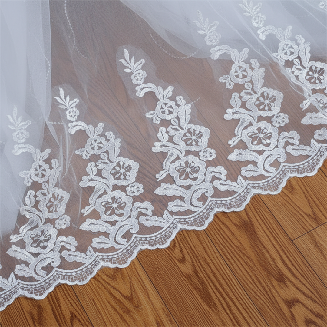 Classic Christian wedding ball gown with elegant lace appliqué and a graceful flowing train