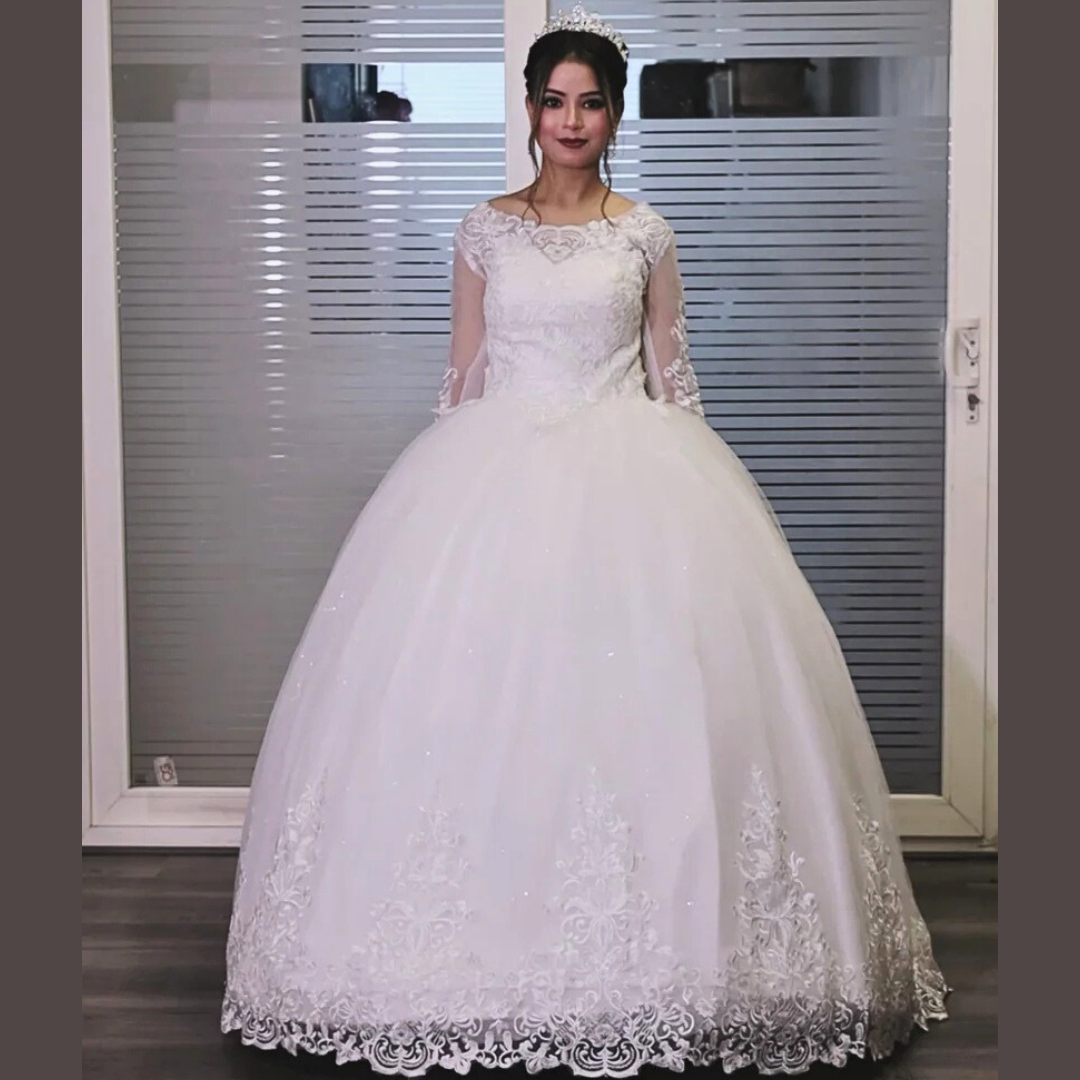 Designer Christian wedding gown by GownLink featuring an illusion lace bodice and graceful ball gown silhouette