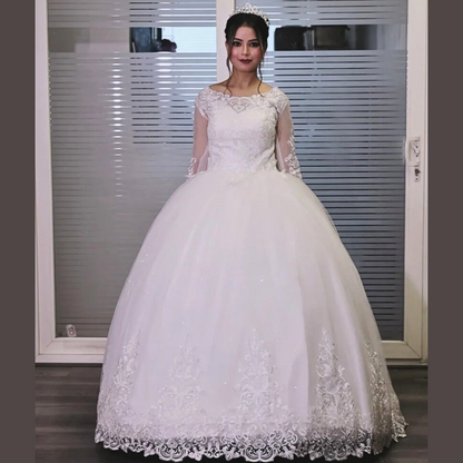 Designer Christian wedding gown by GownLink featuring an illusion lace bodice and graceful ball gown silhouette
