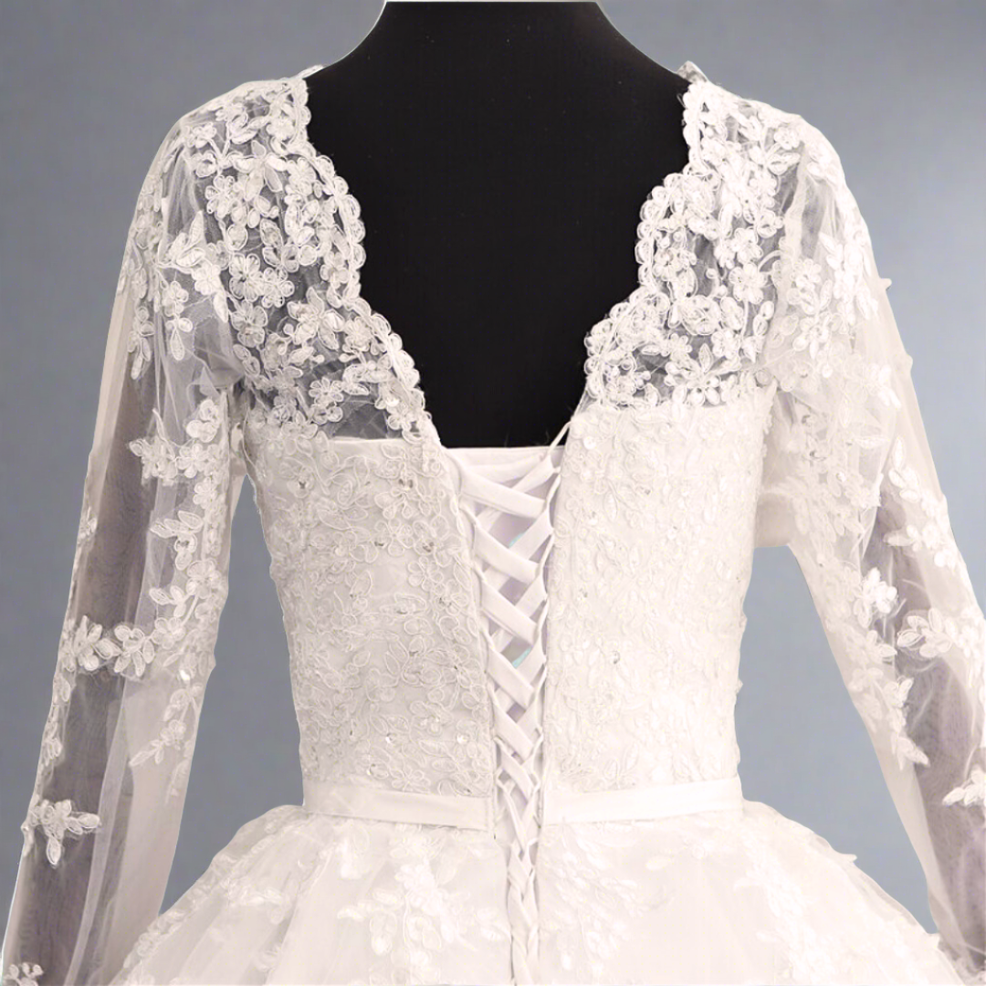 Elegant cathedral wedding dress featuring a lace bodice and full-length bridal train
