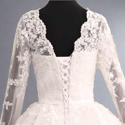 Elegant cathedral wedding dress featuring a lace bodice and full-length bridal train
