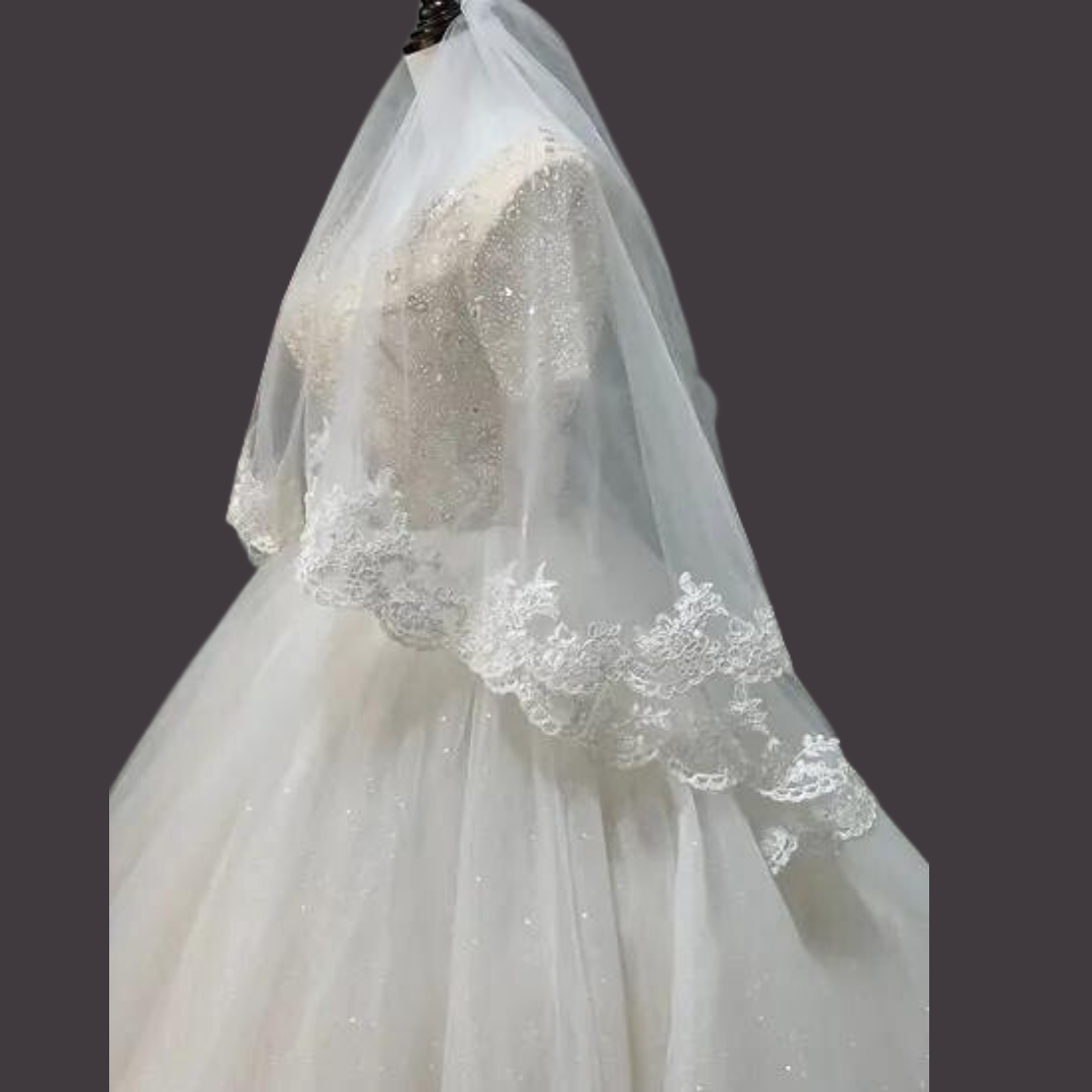 Cathedral length bridal veil with floral lace border and elegant drape