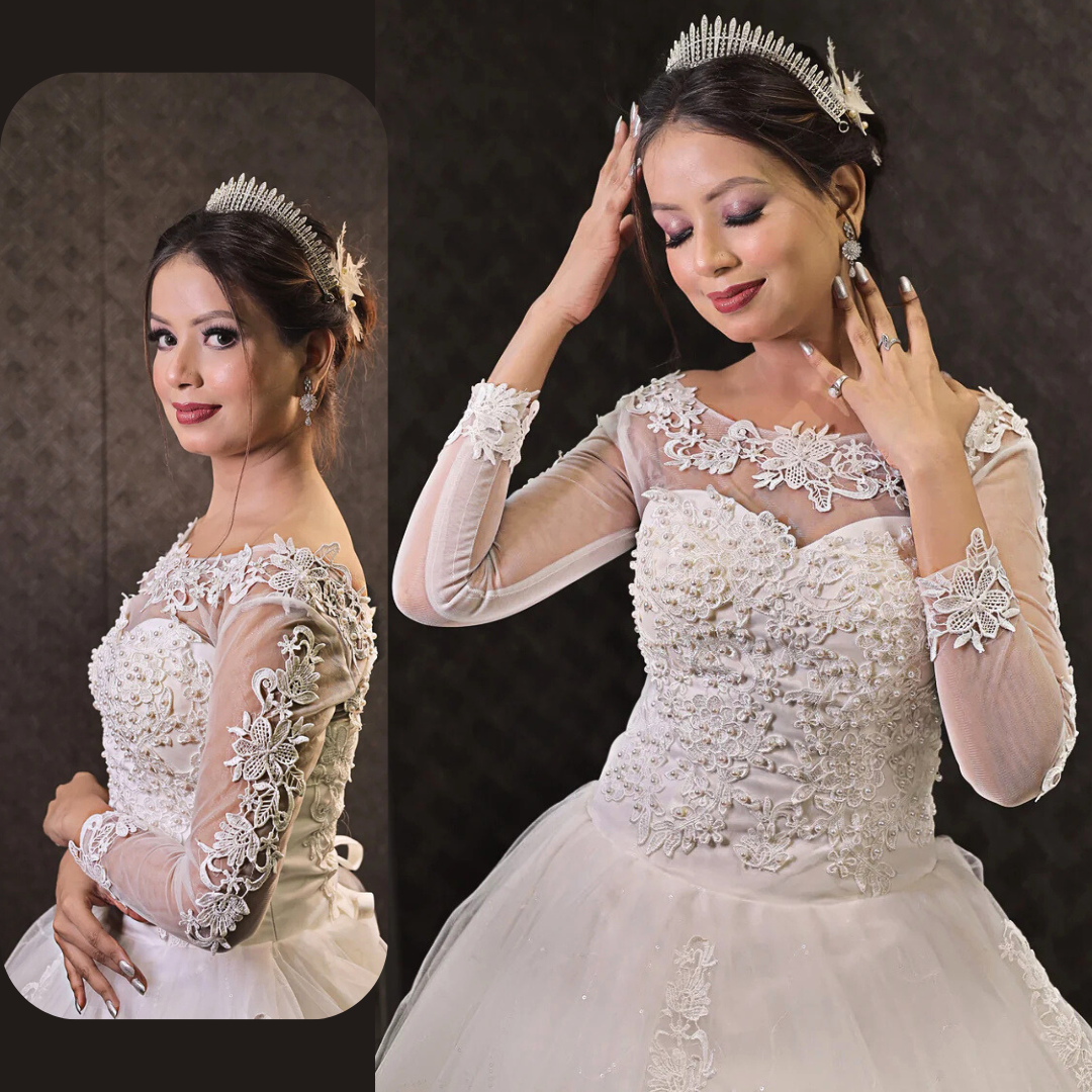 Embroidered lace Christian wedding gown with a voluminous tulle skirt and floral hem detailing
