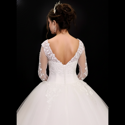 Princess-style wedding gown with embroidered lace bodice and layered bridal skirt