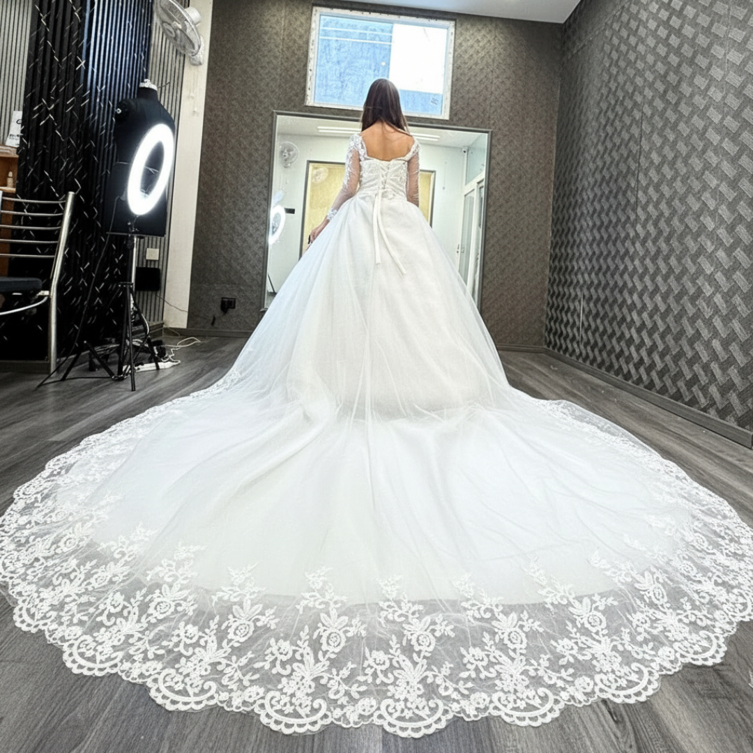 Three-quarter view of White Bridal Gown with Long Train on model — GownLink GLHSD189T