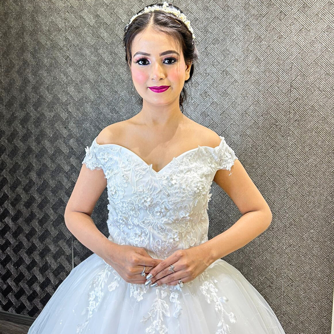 Floral lace princess bridal gown with a full tulle skirt and sophisticated Christian wedding styling