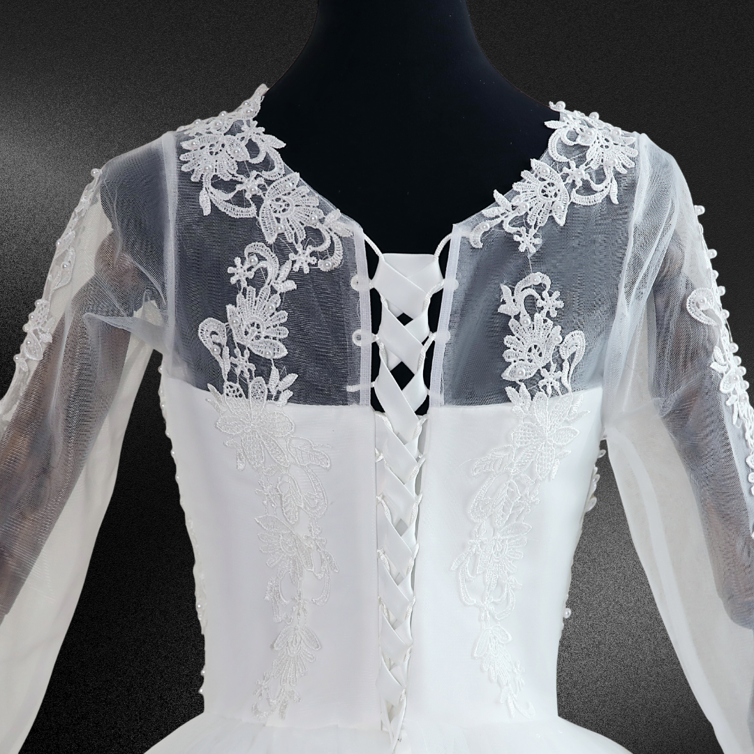 "Exude divine elegance in this breathtaking pearl lace white ball gown."