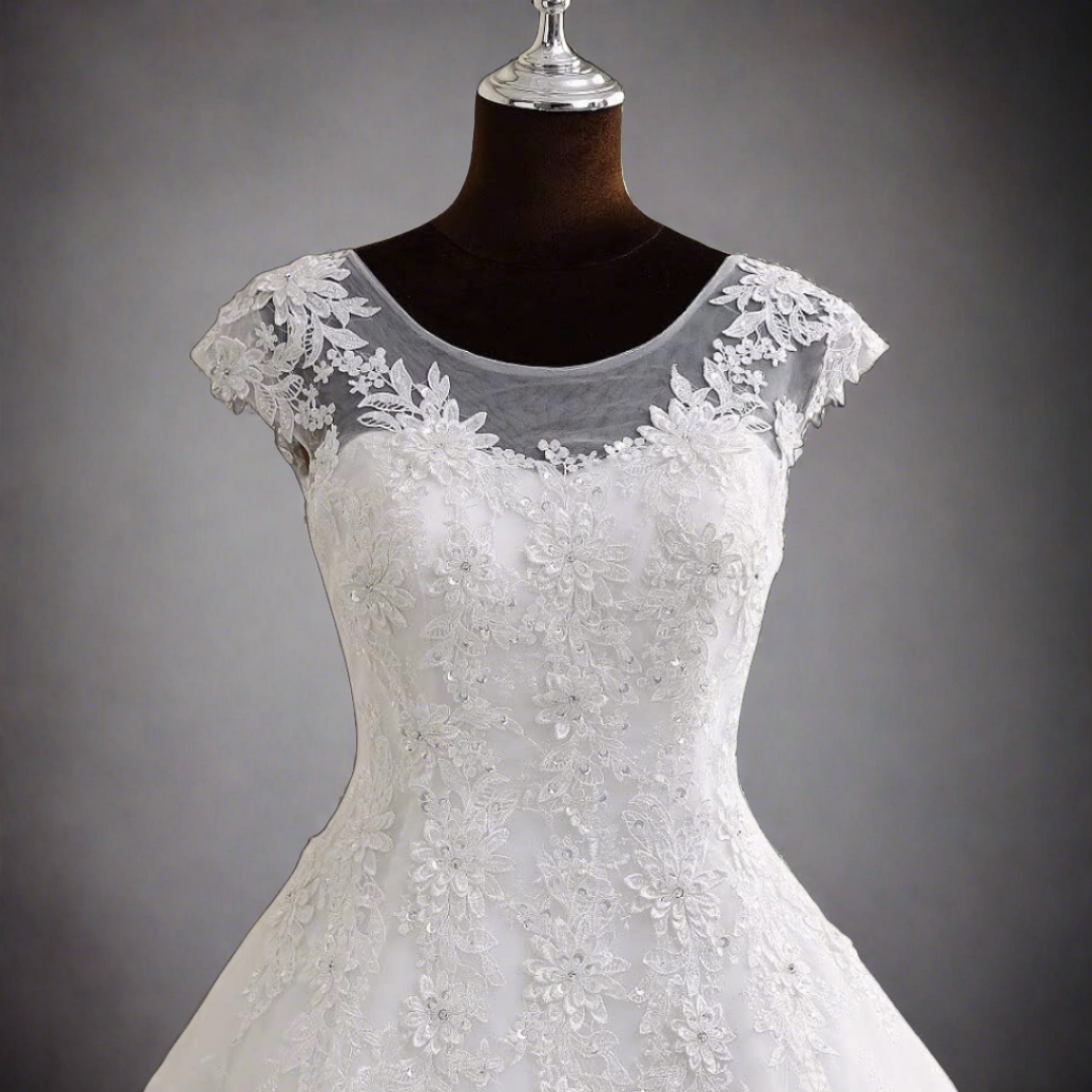 "Classic A-line silhouette on a white Christian wedding gown."