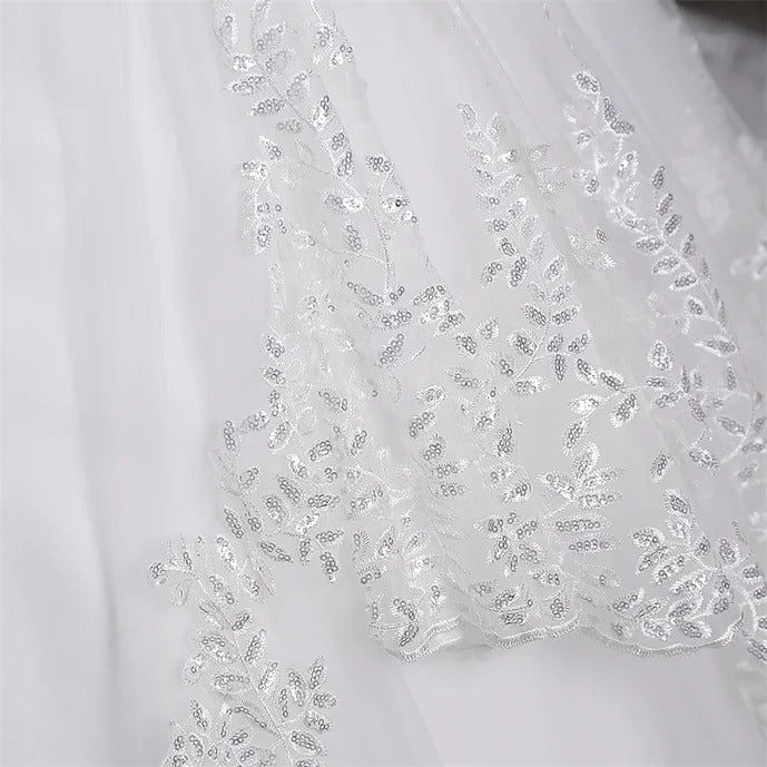 "Enchanting Lace Train Gown for a Catholic Bride's Dream Look"