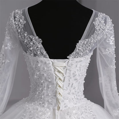 Timeless Catholic bridal gown featuring a lovely back part of train.