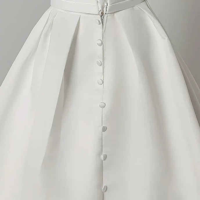 "Ethereal button Train Gown, Ideal for Catholic Wedding Celebrations"