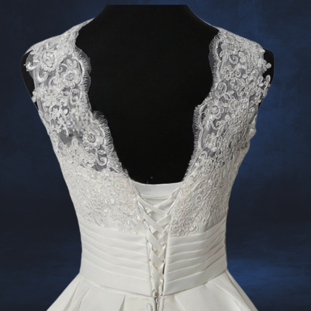 Vintage-inspired white Catholic wedding dress with a patches train. 