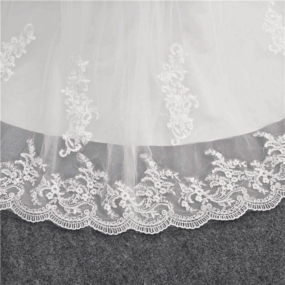 Classic white ball gown featuring a voluminous layered tulle skirt
