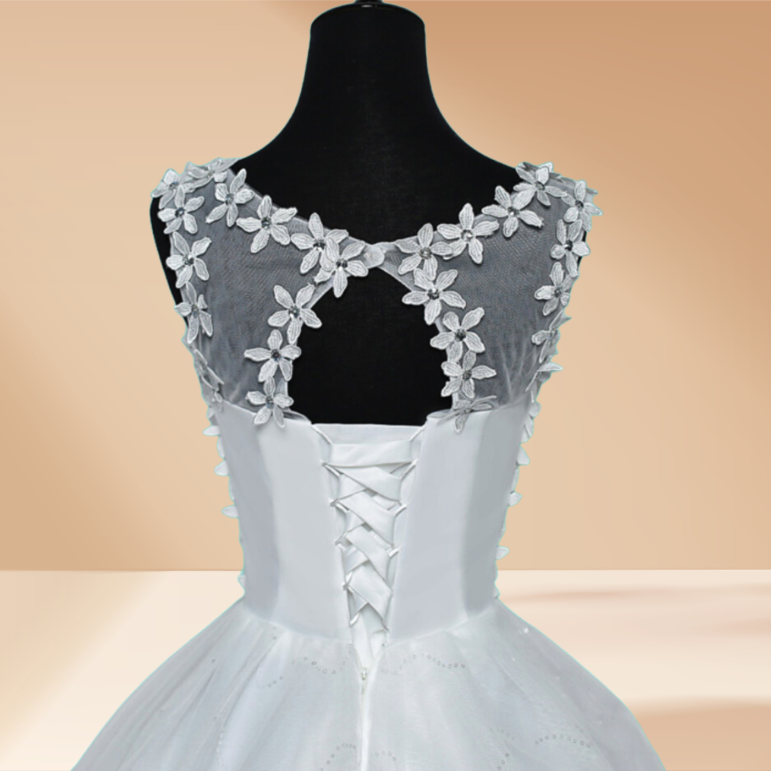 "Flowing Christian wedding gown with stone flower bodice."